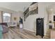 Open-concept living room featuring gray walls, vinyl floors, a staircase and connections to other rooms at 421 Raindance Dr, Henderson, NV 89014