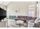 Inviting living room featuring high ceilings, lots of windows, and neutral colored walls at 421 Raindance Dr, Henderson, NV 89014