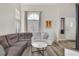 Comfortable living room with vaulted ceiling, large window, gray walls and vinyl flooring at 421 Raindance Dr, Henderson, NV 89014