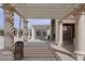 A covered outdoor patio area features white columns and a lattice roof providing shade at 421 Raindance Dr, Henderson, NV 89014