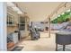 Covered outdoor patio with seating area, grill and steps up to the backyard at 421 Raindance Dr, Henderson, NV 89014