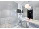 Bright bathroom with dual sinks, marble floors, and a large mirror at 4381 W Flamingo Rd # 1003, Las Vegas, NV 89103