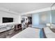 Comfortable bedroom with a workspace, kitchenette, and white tiled bathroom at 4381 W Flamingo Rd # 1003, Las Vegas, NV 89103