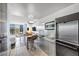 Modern kitchenette featuring sleek stainless steel appliances and an adjacent dining space with city views at 4381 W Flamingo Rd # 1003, Las Vegas, NV 89103