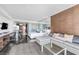Modern open space featuring a comfortable sofa, sleeping area, and sleek design elements throughout at 4381 W Flamingo Rd # 1003, Las Vegas, NV 89103