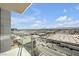 Balcony view features commercial properties, blue sky with clouds and nearby mountains at 4381 W Flamingo Rd # 1003, Las Vegas, NV 89103