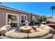 Inviting backyard with patio, outdoor kitchen, and mature landscaping at 448 Bright Moon Ave, North Las Vegas, NV 89084