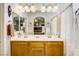 Bathroom featuring double sinks, mirror, and shower-tub combination at 448 Bright Moon Ave, North Las Vegas, NV 89084