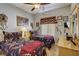 Cozy bedroom featuring twin beds, ceiling fan, and charming decorative accents at 448 Bright Moon Ave, North Las Vegas, NV 89084