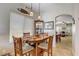 Cozy dining area with wood table, chandelier, and lots of natural light at 448 Bright Moon Ave, North Las Vegas, NV 89084