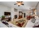 Spacious living room with fireplace, adjacent to dining area at 448 Bright Moon Ave, North Las Vegas, NV 89084