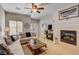 Cozy living room features fireplace and ample natural light at 448 Bright Moon Ave, North Las Vegas, NV 89084