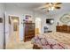 Main bedroom showcasing large windows, walk-in closet, and a view into the en-suite bathroom at 448 Bright Moon Ave, North Las Vegas, NV 89084