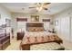 The main bedroom has a large bed, ceiling fan, and closet at 448 Bright Moon Ave, North Las Vegas, NV 89084