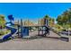 Community playground featuring a blue slide, climbing structures, and safety surfacing provides fun for residents at 448 Bright Moon Ave, North Las Vegas, NV 89084
