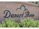 Attractive community signage for Desert Moon, surrounded by lush green bushes at 448 Bright Moon Ave, North Las Vegas, NV 89084