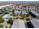 Community aerial view shows landscaping, mountain views, pool, and nearby playground at 4566 Mansart Ct # 1104, North Las Vegas, NV 89031