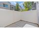 Private backyard enclosed by a white fence, providing a cozy outdoor retreat at 4566 Mansart Ct # 1104, North Las Vegas, NV 89031