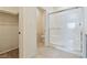 Bathroom showcasing walk-in closet, toilet, and glass-enclosed shower, designed for functionality at 4566 Mansart Ct # 1104, North Las Vegas, NV 89031