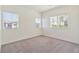 Bright bedroom with three windows, carpet flooring, and neutral walls provides a comfortable space at 4566 Mansart Ct # 1104, North Las Vegas, NV 89031