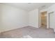 Spacious, carpeted bedroom with neutral walls and view of bathroom, offering a relaxing retreat at 4566 Mansart Ct # 1104, North Las Vegas, NV 89031
