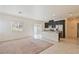 Bright, open kitchen featuring dark cabinetry, stainless steel appliances, and an island with granite countertops at 4566 Mansart Ct # 1104, North Las Vegas, NV 89031