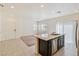 Modern kitchen featuring an island with granite countertops and stainless steel appliances at 4566 Mansart Ct # 1104, North Las Vegas, NV 89031