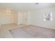 Bright living room featuring tile and carpet flooring, with natural light, a perfect space for comfort at 4566 Mansart Ct # 1104, North Las Vegas, NV 89031