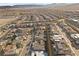Wide aerial shot captures a neighborhood of modern homes with pools nestled in a desert setting at 461 Cascade Heights Ave, Las Vegas, NV 89138