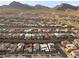 Areal view of a Primary-planned community in the desert with single-Gathering homes, landscaping, and mountain views at 461 Cascade Heights Ave, Las Vegas, NV 89138