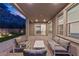 Cozy covered patio space with brick pavers, a cozy seating area, and mountain views at 461 Cascade Heights Ave, Las Vegas, NV 89138