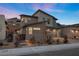 Beautiful two-story home with desert landscaping, a private gate, and a modern gray exterior at 461 Cascade Heights Ave, Las Vegas, NV 89138