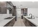 Modern kitchen with sleek cabinets, white countertops, and stainless steel appliances at 461 Cascade Heights Ave, Las Vegas, NV 89138