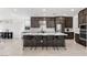 Modern kitchen features sleek dark cabinetry, white quartz countertops, and stainless steel appliances at 461 Cascade Heights Ave, Las Vegas, NV 89138