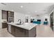 Modern kitchen and open staircase to the second story at 461 Cascade Heights Ave, Las Vegas, NV 89138