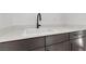 Laundry room features a undermount sink, modern faucet, and quartz countertops at 461 Cascade Heights Ave, Las Vegas, NV 89138