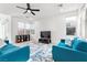 Bright living room featuring a ceiling fan, modern furniture, and plenty of natural light at 461 Cascade Heights Ave, Las Vegas, NV 89138