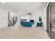 Spacious living room featuring tile floors, lots of natural light, and staircase leading upstairs at 461 Cascade Heights Ave, Las Vegas, NV 89138