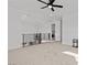 Spacious loft area with modern railing, ceiling fan, and natural light, creating an inviting space at 461 Cascade Heights Ave, Las Vegas, NV 89138