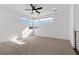 Bright upstairs loft area with a ceiling fan, natural light, and a versatile space for any use at 461 Cascade Heights Ave, Las Vegas, NV 89138
