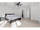 Spacious main bedroom featuring a ceiling fan, plush carpet, and ample natural light at 461 Cascade Heights Ave, Las Vegas, NV 89138
