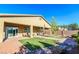 A backyard featuring desert landscaping, covered patio, and a view of the house at 4837 Skyraider St, North Las Vegas, NV 89031