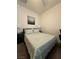 Cozy bedroom with a queen-sized bed, soft lighting, and neutral decor at 4837 Skyraider St, North Las Vegas, NV 89031