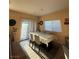 Dining area featuring tile floors and a large table at 4837 Skyraider St, North Las Vegas, NV 89031