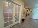 Hallway with stylish tile flooring and glass French doors at 4837 Skyraider St, North Las Vegas, NV 89031