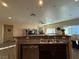 The kitchen featuring a breakfast bar and open view into the living room at 4837 Skyraider St, North Las Vegas, NV 89031