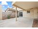 A spacious covered back patio with access to the home through a sliding glass door at 4920 Larkspur St, Las Vegas, NV 89120