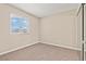Bedroom with neutral walls, carpet, and a double-hung window that brings in natural light at 4920 Larkspur St, Las Vegas, NV 89120