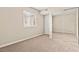 Bedroom with neutral walls, carpet, a double-hung window, and closet with mirrored sliding doors at 4920 Larkspur St, Las Vegas, NV 89120