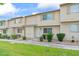 Charming townhouse featuring well-maintained landscaping, a neatly manicured lawn, and a welcoming entrance at 4920 Larkspur St, Las Vegas, NV 89120